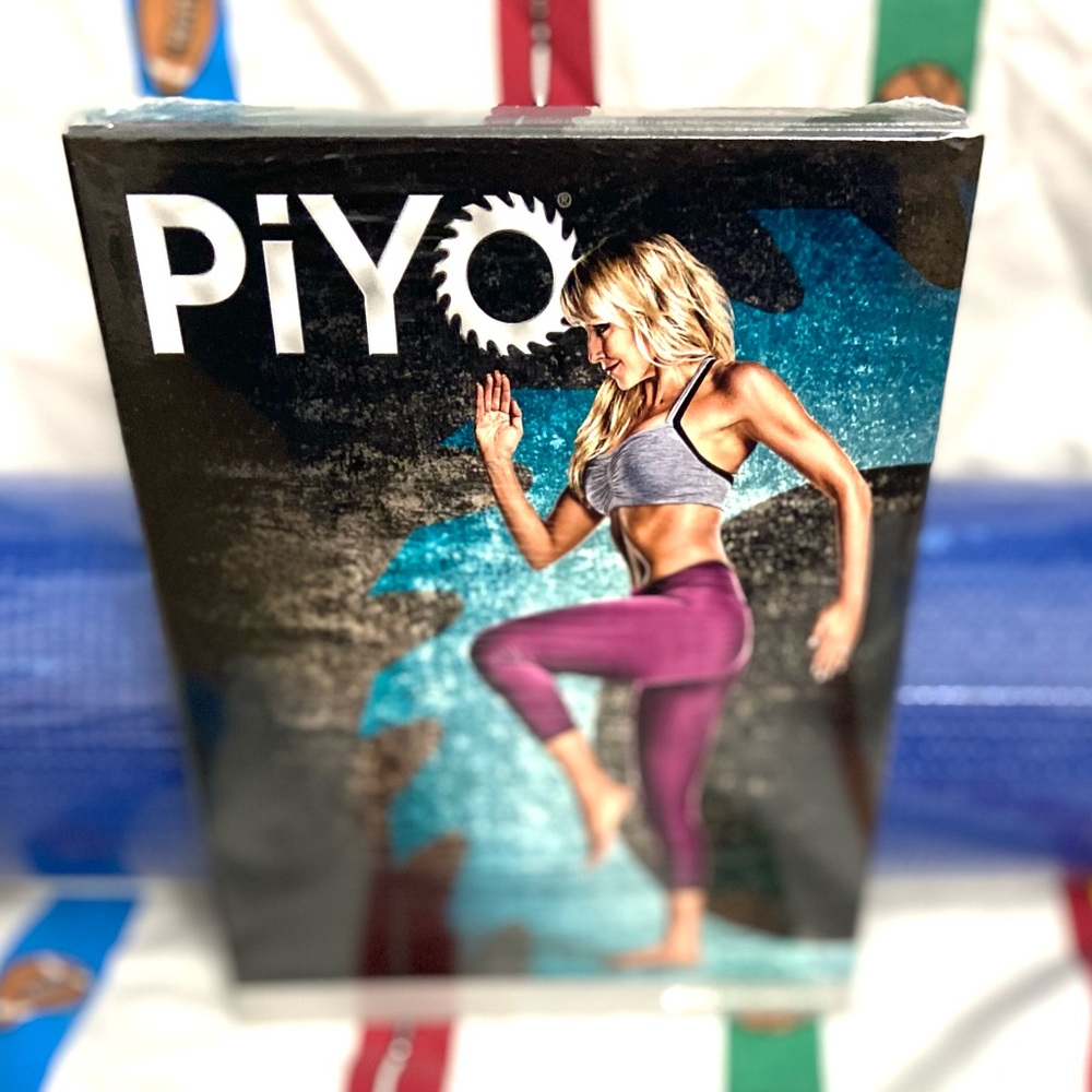 Beachbody PIYo DVD & yoga mat. Still with plastic wrap on yoga mat & DVD.
